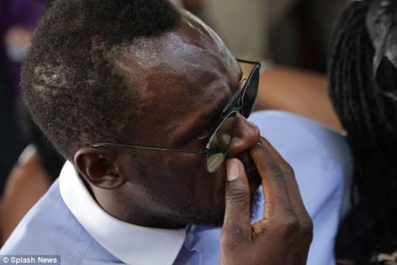 Usain Bolt cries as he serves as pallbearer at the funeral of his late  friend/Olympic