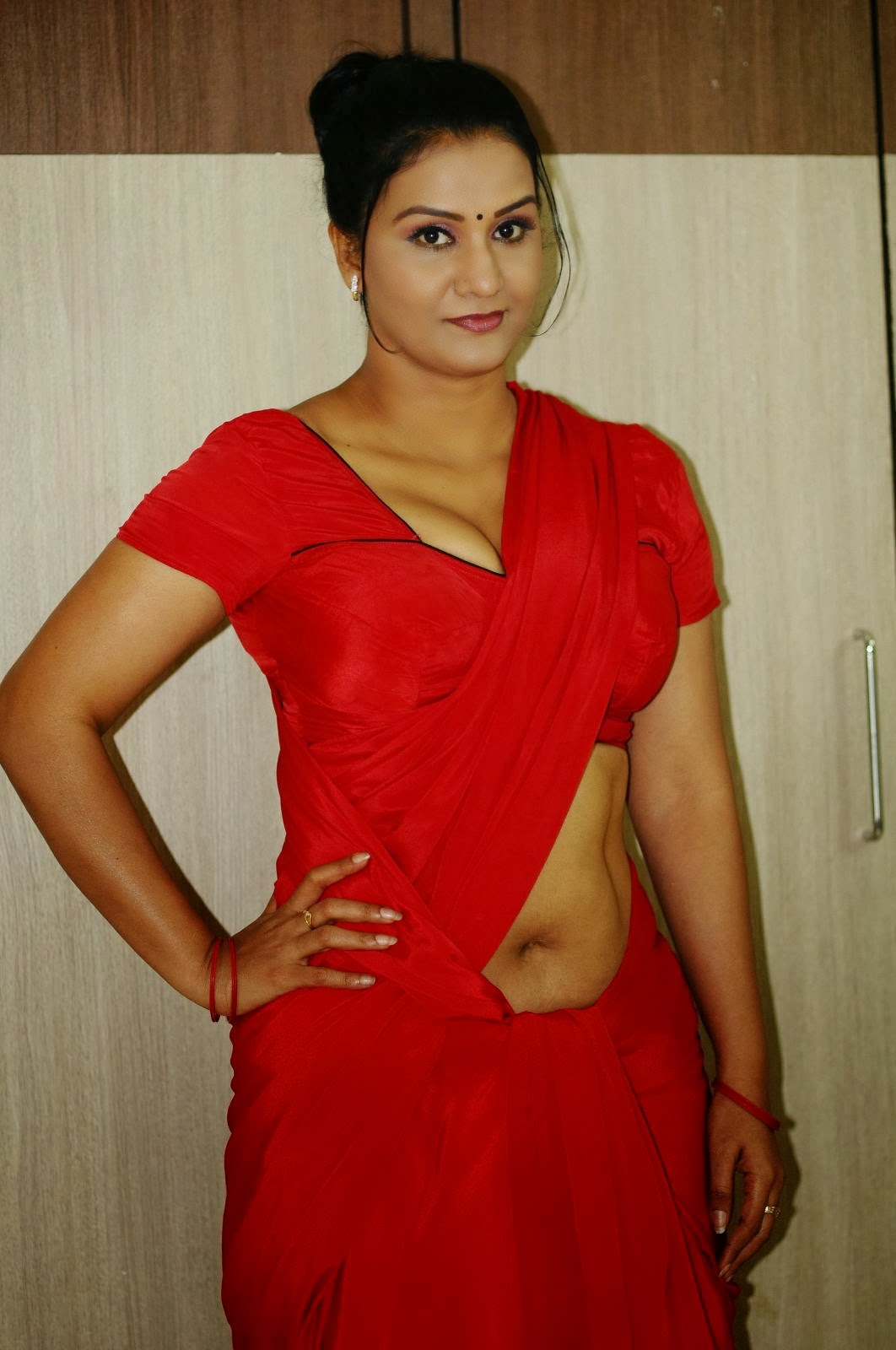 Actress Apoorva Hot Navel Show in Red Saree Photo Gallery