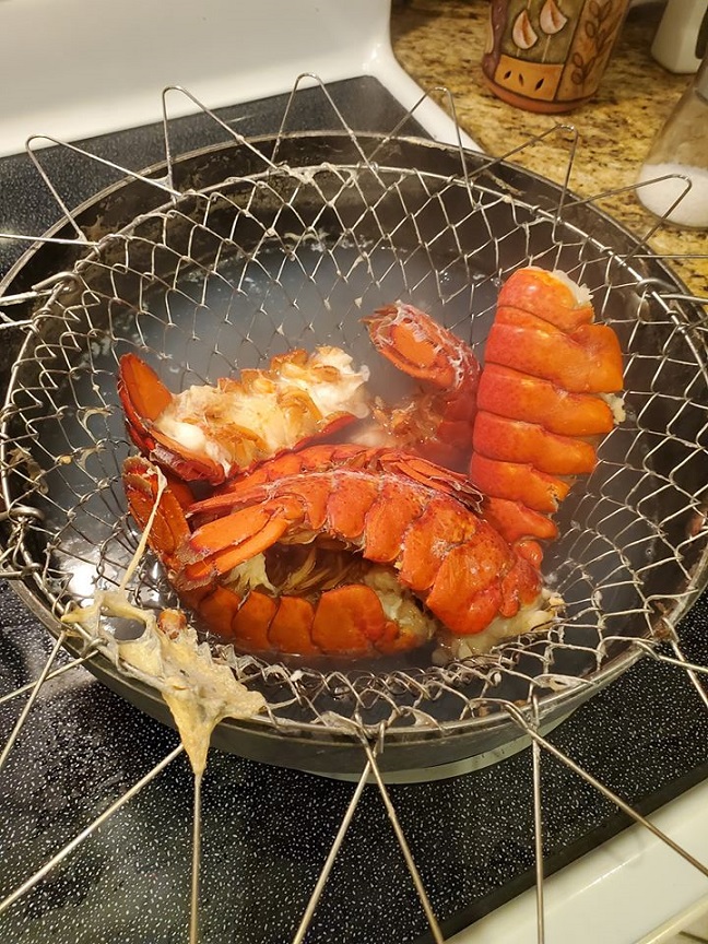 these are 6 maine lobster tails in a wire basket boiled