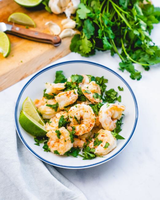 This cilantro lime shrimp is a healthy, easy dinner recipe that takes just 10 minutes! Serve with rice, in tacos, or as a Mexican-style salad topping.