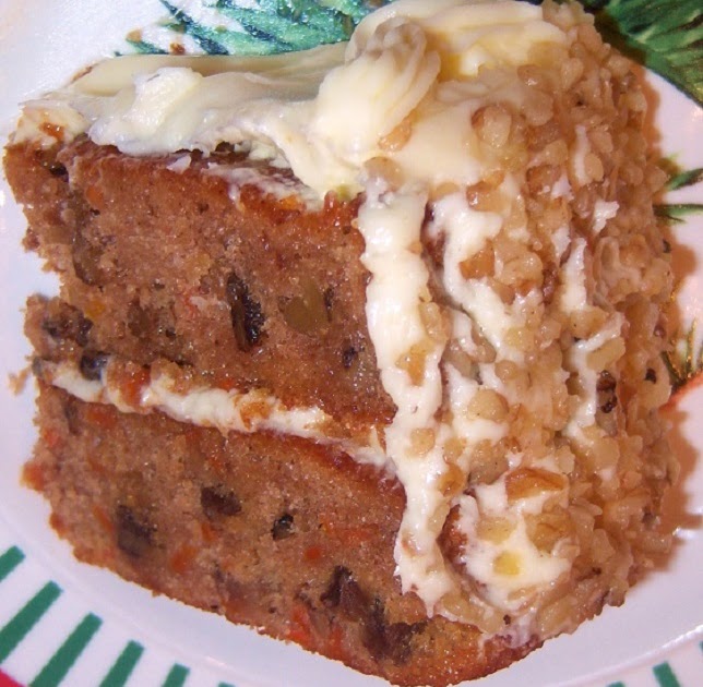 Close Up of Carrot Cake with Topping Cream and Green Pistache for