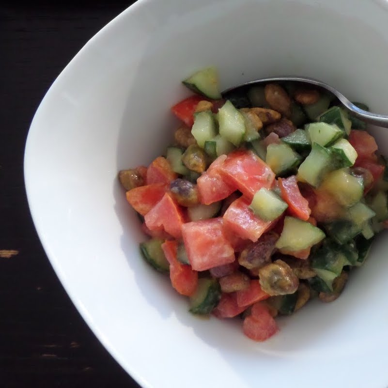 Tomato and Cucumber Salad:  A light and fresh salad of crisp cucumbers, juicy tomatoes, and crunchy pistachios tossed in a sweet creamy lemon dressing.