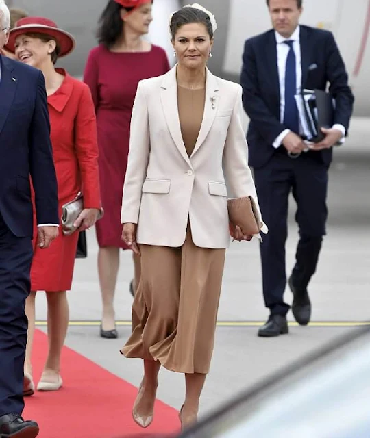 Elke Büdenbender, Queen Silvia, Prince Carl Philip, Princess Sofia. Crown Princess Victoria wore a blazer by Andiata