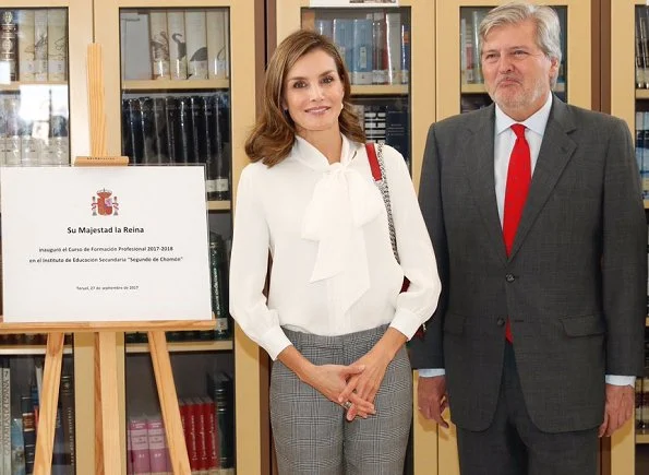 Queen Letizia wore Zara silk blouse, Mango Prince of Wales trouser and carried Zara Laser Cut Leather Crossbody Bag