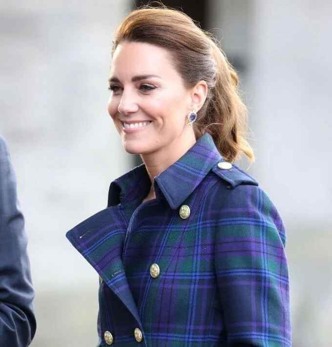 Kate Middleton wore a full length marlborough heather tartan trench coat  from Holland Cooper. Joseph metallic knitted skirt