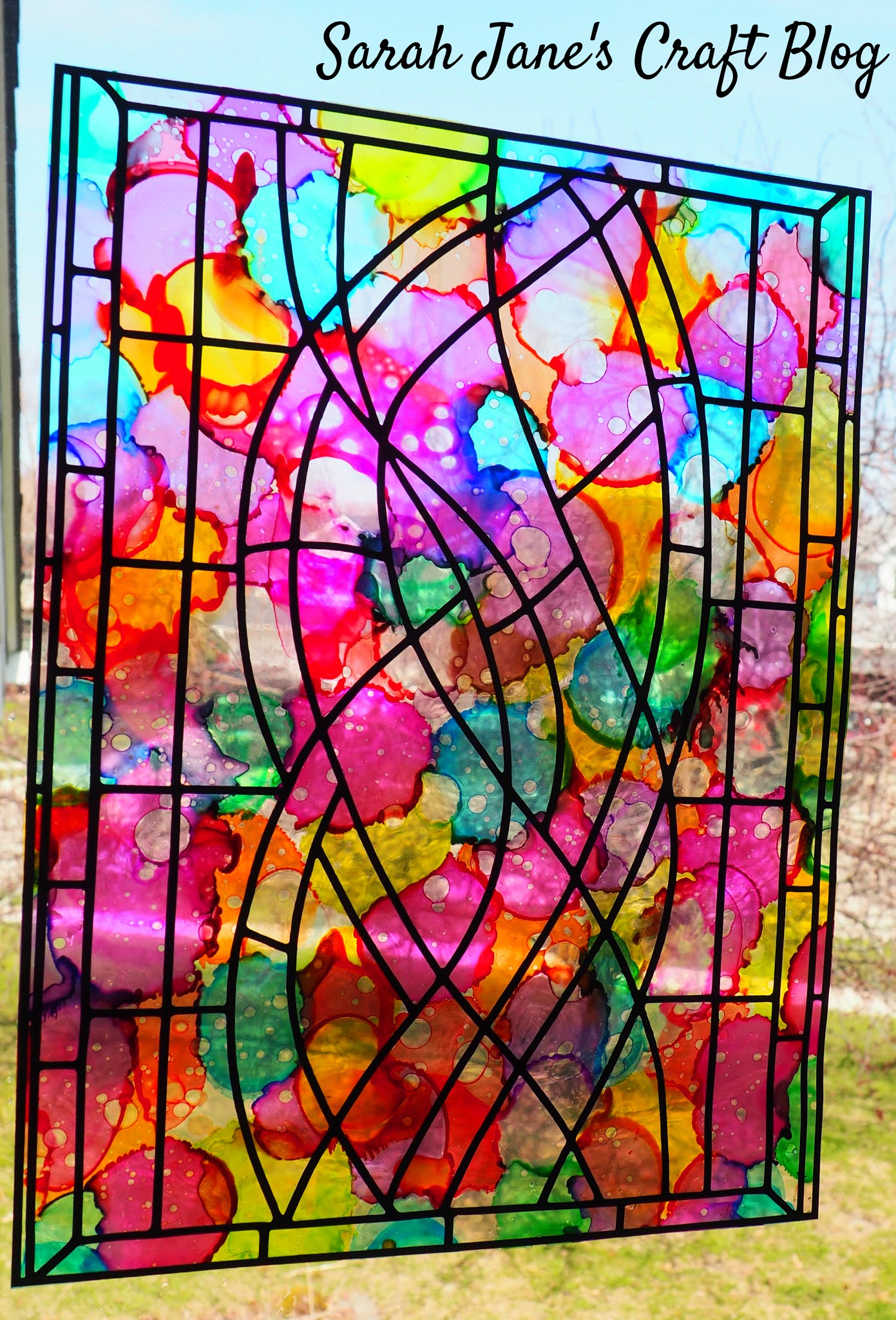 Faux Stained Glass made with Alcohol Ink, Laminating Pouches, and Vinyl