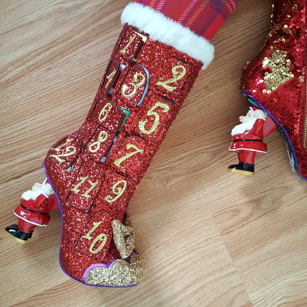 red sparkly advent calendar boots with Santa character heel