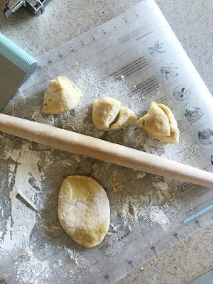 pasta dough with a rolling pin