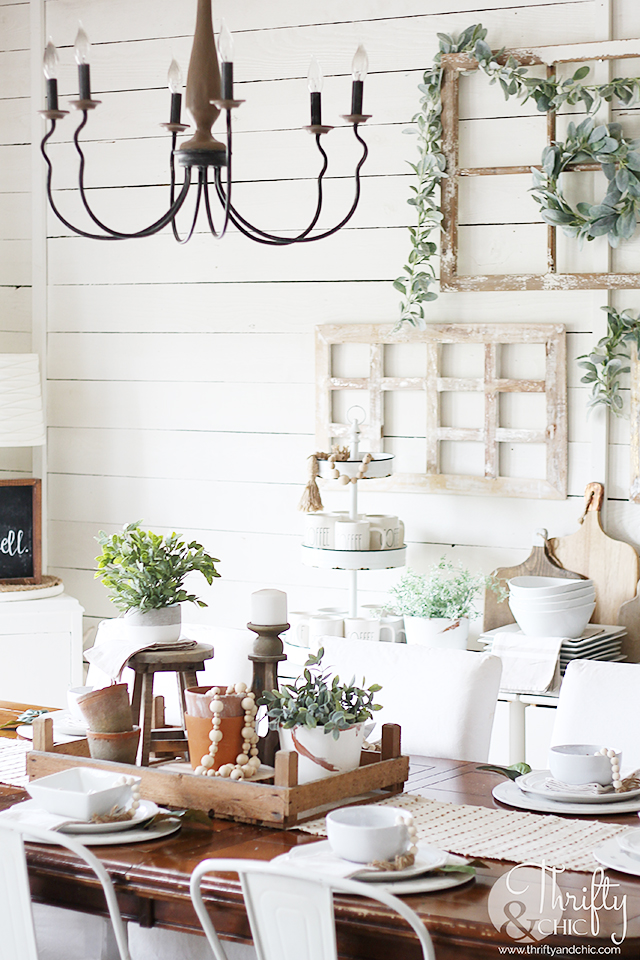 Summer dining room decor and decorating ideas. Farmhouse dining room decor. Farmhouse tablescape decor. DIY place setting ideas. Dining room buffet ideas. Farmhouse chandelier. Wood and metal chandelier. Dining room wall decor. Wood and white dining room decor.