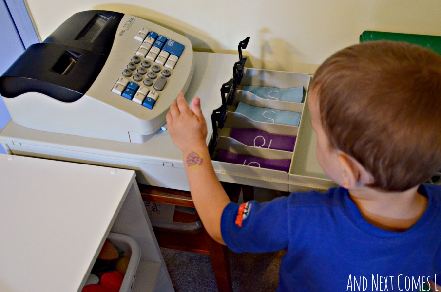 Pretend play in the playroom with a real cash register from And Next Comes L