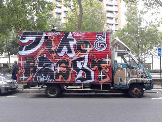 Van covered with graffiti wall for urban van life, not necessarily down by the river. Vanholio.com