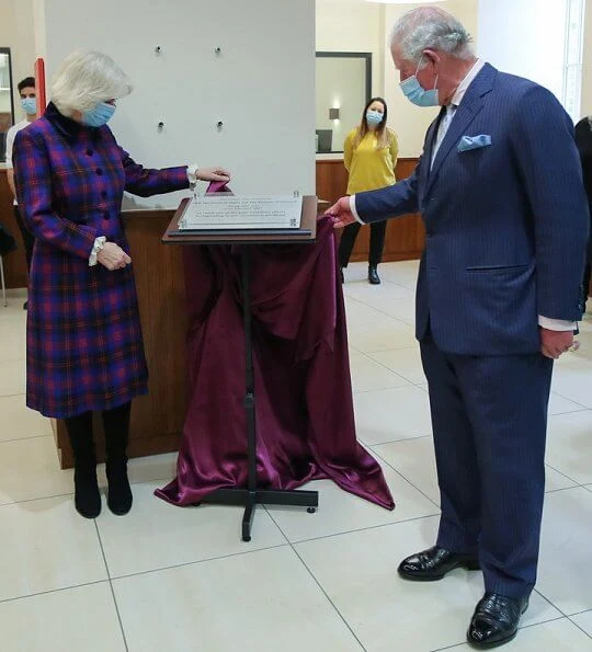 The Prince of Wales and the Duchess of Cornwall visited the Queen Elizabeth Hospital. Tartan coat dress