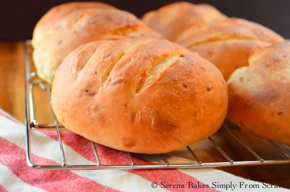 Cheddar Cheese Hamburger Buns are crusty on the outside with a soft chewy center with lots of cheddar flavor! These are the perfect cheddar bun for your next barbecue from Serena Bakes Simply From Scratch.