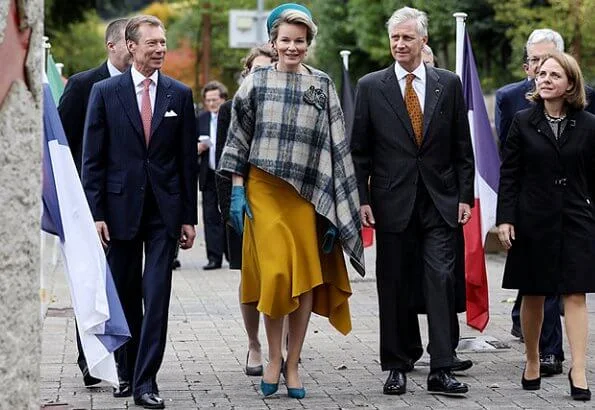 Queen Mathilde wore asymmetric yellow midi dress Natan aw2019 collection. The Queen wore a new asymmetric yellow midi dress by Natan