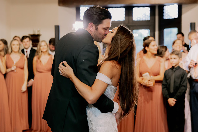 bride and groom kissing on dancefloor
