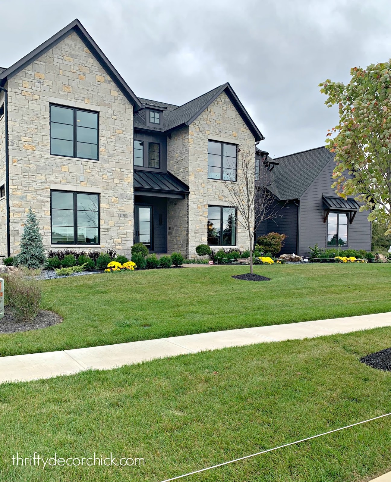 Black windows stone exterior black garage 