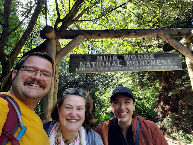 Image of three people at Muir Woods entrance