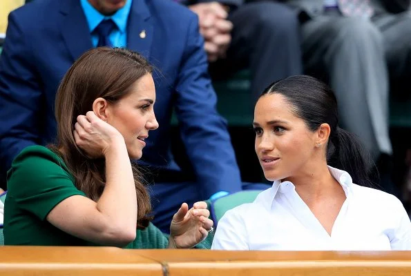 Kate Middleton wore a green midi dress by Dolce & Gabbana. Meghan Markle wore a print midi skirt by Hugo Boss