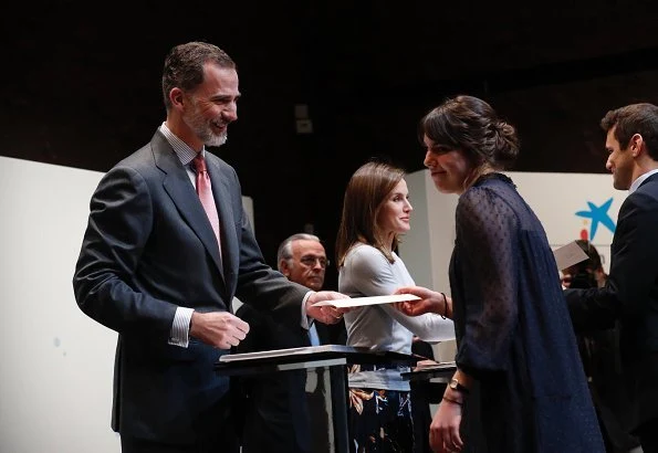 Queen Letizia wore Hugo Boss Fayme crew neck wool sweater and Hugo Boss Viplisa Skirt, Carolina Herrera sandals and she carries Hugo Boss clutch