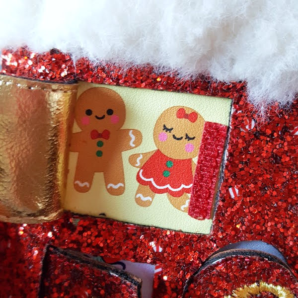 gingerbread imagery behind door on advent calendar boots