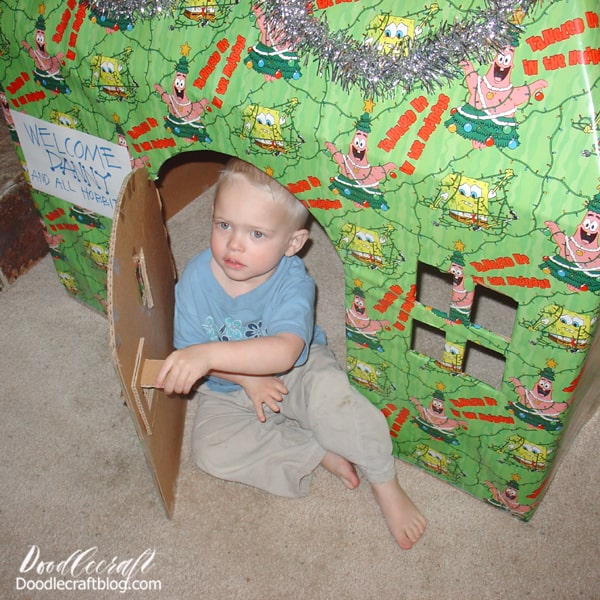 When our baby boy was 2, we couldn't afford gifts at all. We felt a little dejected as parents, but again, got creative. We found this giant box at my dad's house and convinced him to give it to us. Then my hubby and I cut a hinged door, open windows and a pitched roof. Then we wrapped it carefully in some wrapping paper we took from my in-laws.   It took us time, but no money. Guess what!? He was thrilled! He and all his cousins wanted to spend all Christmas morning playing in Danny's house--and didn't care about any other presents. It was wonderful--and the favorite gift of Christmas that year!