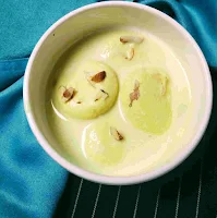 Garnished rasmalai in a serving bowl for rasmalai recipe