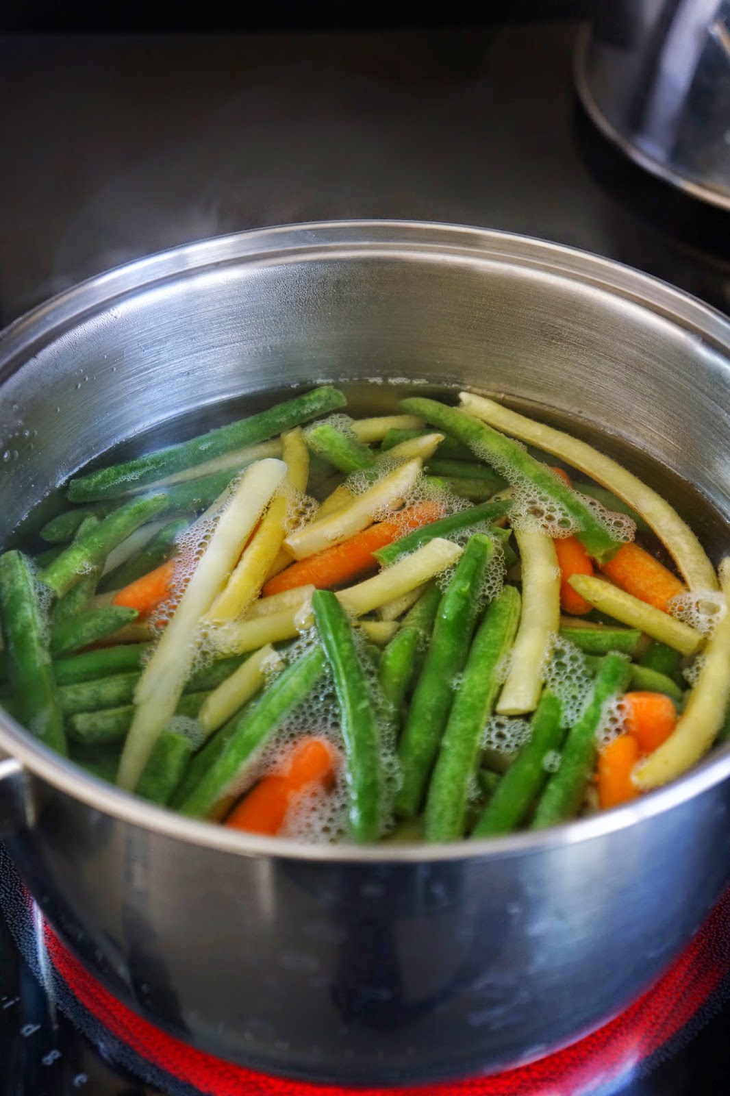 Green and yellow bean salad with baby carrots