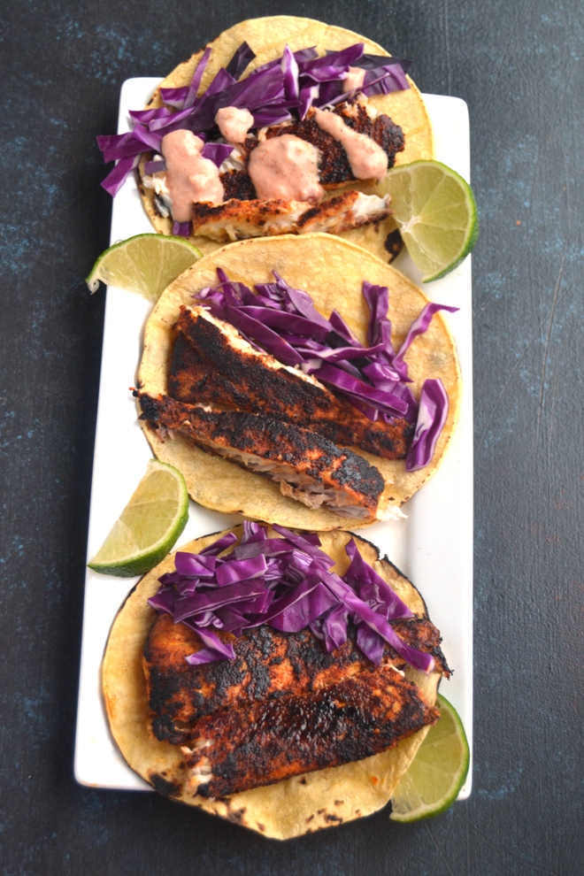 Alaska Blackened Fish Tacos features dry rubbed, blackened sauteed black cod with crunchy red cabbage, fresh lime juice and a creamy salsa dressing in a toasted corn tortilla! www.nutritionistreviews.com