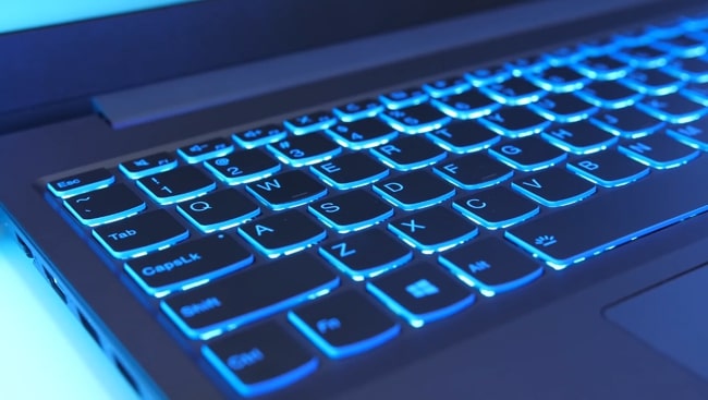 The single zonal blue backlit of Lenovo IdeaPad L340 laptop keyboard.
