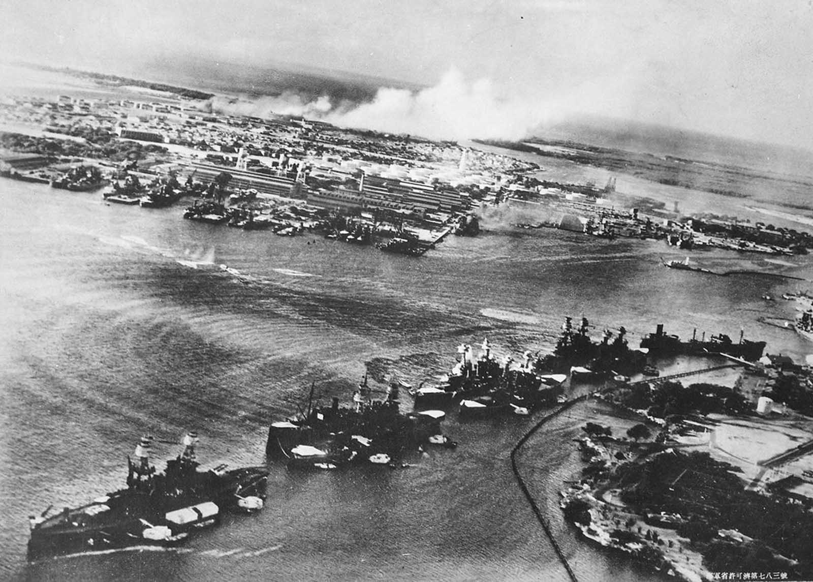 Captured Japanese photograph taken during the attack on Pearl Harbor, December 7, 1941. In the distance, the smoke rises from Hickam Field. 