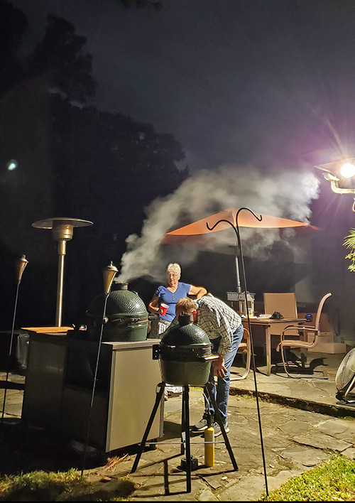 Late night grilling on a Big Green Egg in a Challenger Designs grill cart