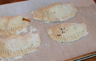 This is homemade pie dough filled with pumpkin filling and made into turnovers