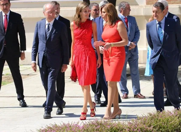 Queen Letizia wore NINA RICCI Plissé dress and carried a red Carolina Herrera animal print clutch bag