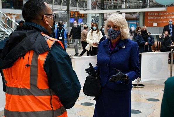 Duchess of Cornwall visited Paddington Station to watch a demonstration by the charity Medical Detection Dogs. blue navy blazer