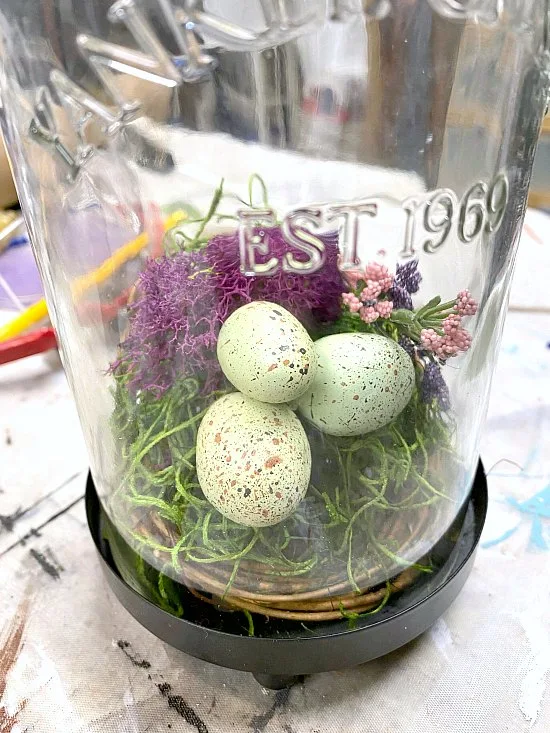 nest with eggs inside lantern