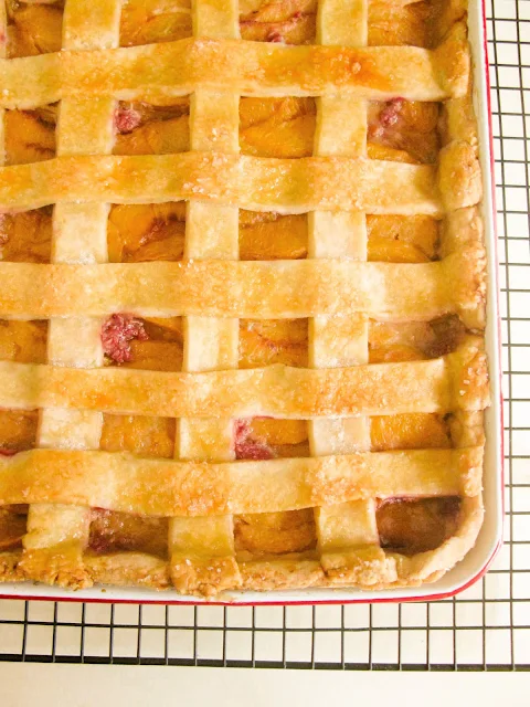 Fresh Vanilla Peach Slab Pie,  fresh juicy peaches in a buttery lattice crust, baked in a rimmed baking sheet pan.  Easy to serve and perfect for a large crowd.