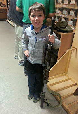 Boy Holding Rifle