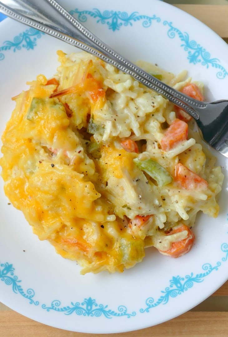 Dinner doesn't get much better than this delicious comfort food casserole! It's packed with carrots, green pepper and onion and uses easy ingredients like leftover rotisserie chicken, rice a