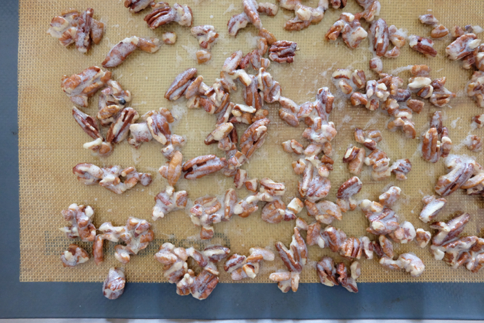 baked candied pecans on baking sheet