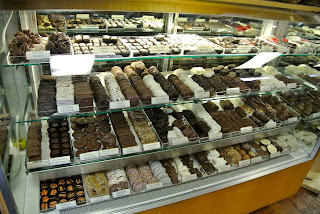 A display stand full of chocolate sweets.
