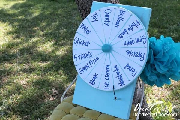 How to Make a DIY Spinner Prize Wheel for carnivals, parties, events or even a chore chart. Lazy Susan and dry erase vinyl pull this spinning wheel together!