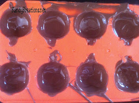 Celebrate Halloween with this sweet Pumpkin candy recipe.  These chocolate covered cherries are in the shape of pumpkins using a cheap dollar store mold and an easy candy recipe.  These chocolate candies are perfect for any fall holiday including Halloween and Thanksgiving, or just a more beautiful take on the store bough chocolate covered cherries.