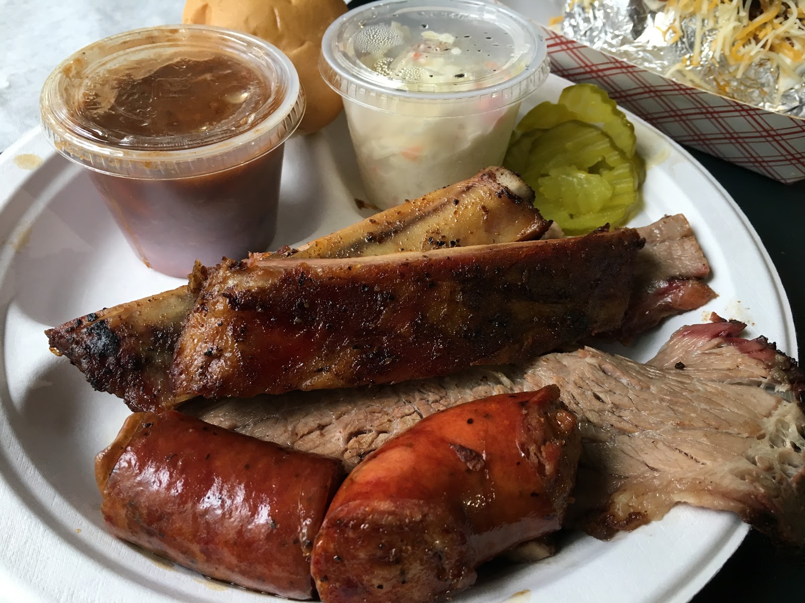 Texas mesquite-smoked BBQ barbecue brisket ribs turkey sausage beans