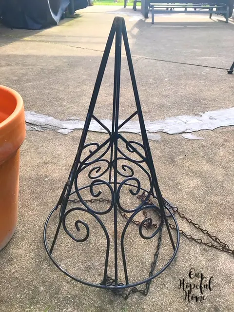 black metal cone shaped hanging planter
