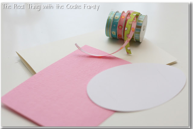 card, egg cut out, and ribbon