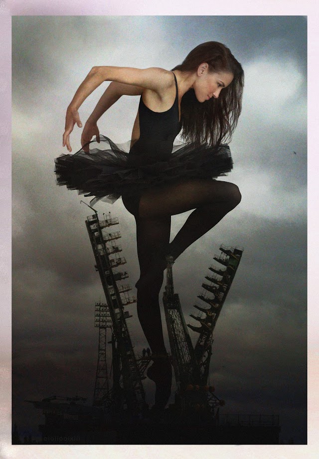 Moody image with troubled sky. A giant ballerina stands en pointe within the Soyuz launch pad support structure at Baikonur Cosmodrome. Two workers stand beside her ankle which is grasped by the structure. The giant ballerina's gaze is fixed on a bird flying in front of her.