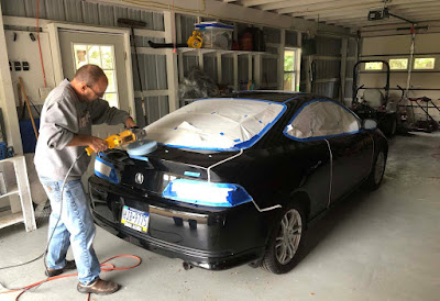 Chris VanStavoren polishing a 2006 Acura RSX