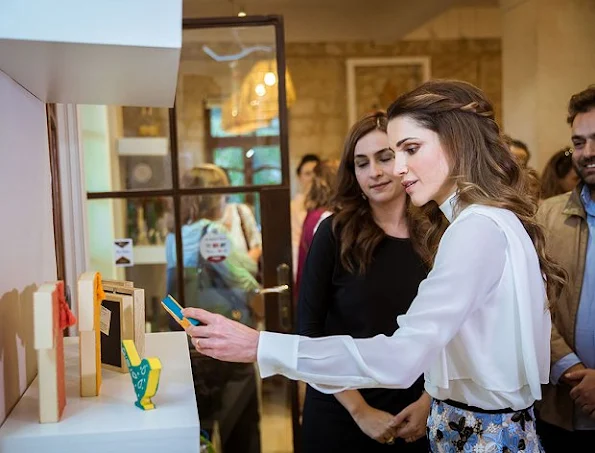 JRF Director General Mrs. Enaam Barrishi accompanied Her Majesty while touring the exhibition and viewing the handmade items on display