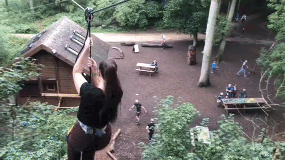 a GIF image showing Grace's sister going down a zipwire