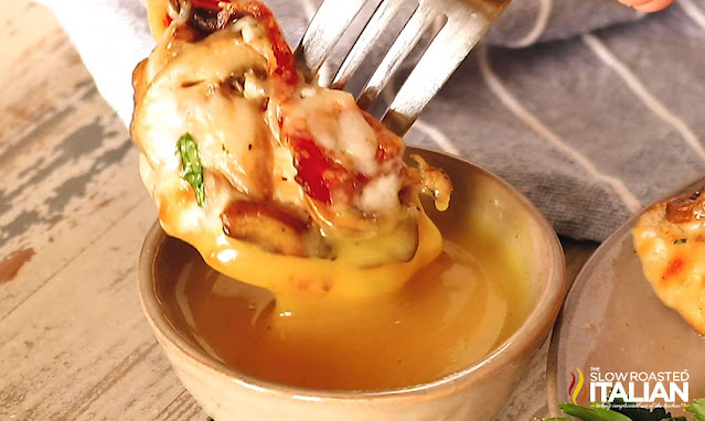 Dipping chicken into sauce